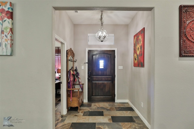 entryway with a notable chandelier