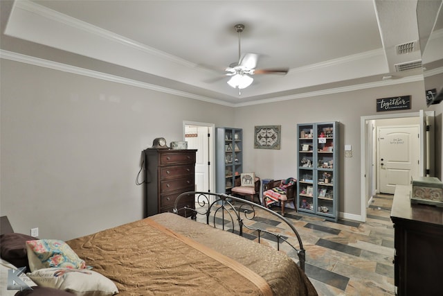 bedroom with ornamental molding, ceiling fan, and a raised ceiling