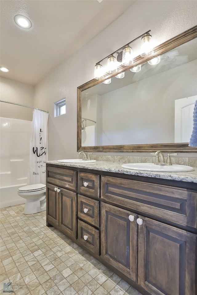 full bathroom featuring shower / tub combo, vanity, and toilet