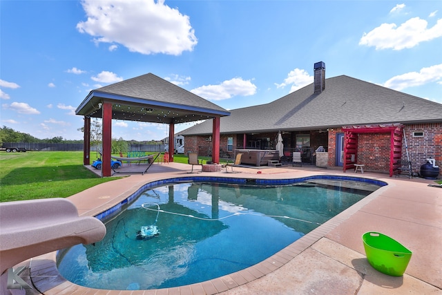 view of pool featuring a water slide, a gazebo, a yard, and a patio area