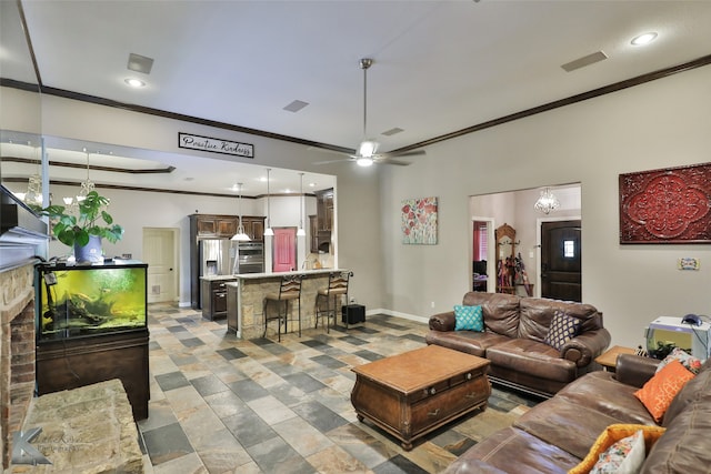 living room with crown molding and ceiling fan