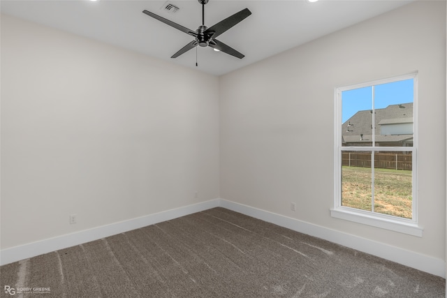 spare room with carpet floors and ceiling fan