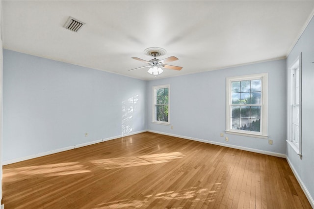 spare room with ceiling fan and wood-type flooring