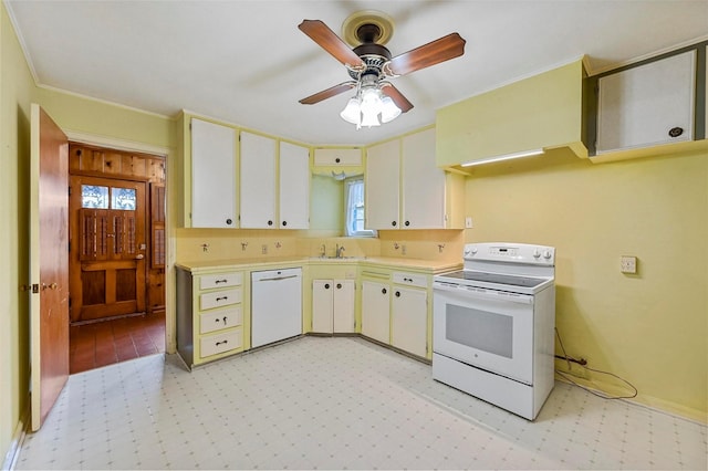 kitchen with white appliances, ceiling fan, crown molding, sink, and white cabinetry