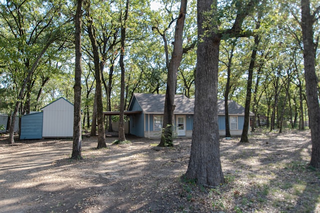 view of front facade with a shed