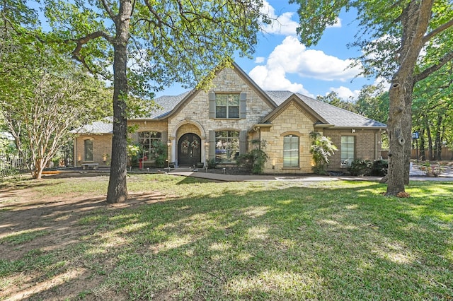 view of front of property with a front lawn