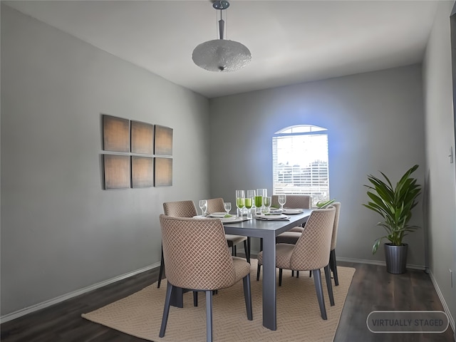 dining room with dark hardwood / wood-style flooring