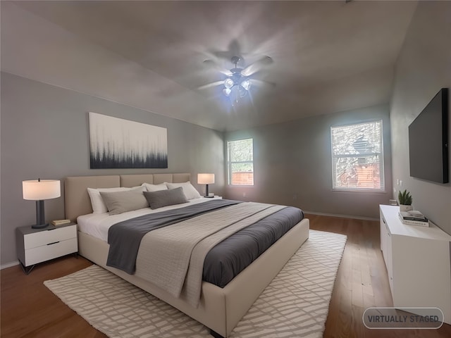 bedroom with ceiling fan and hardwood / wood-style floors