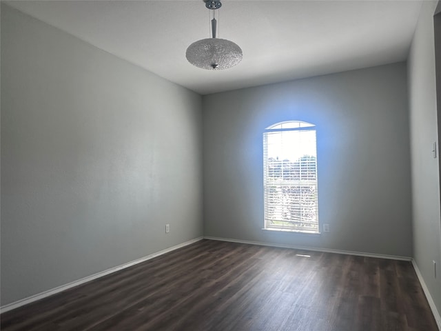 empty room featuring dark hardwood / wood-style floors