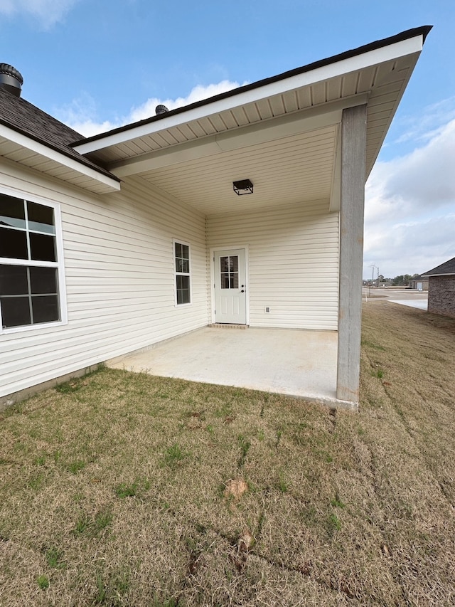 exterior space featuring a lawn and a patio area