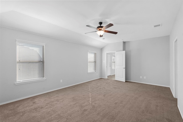 unfurnished bedroom featuring lofted ceiling, carpet flooring, and ceiling fan