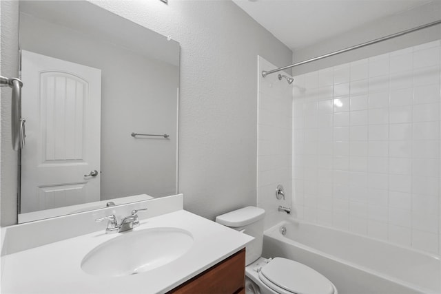 full bathroom featuring vanity, toilet, and tiled shower / bath combo