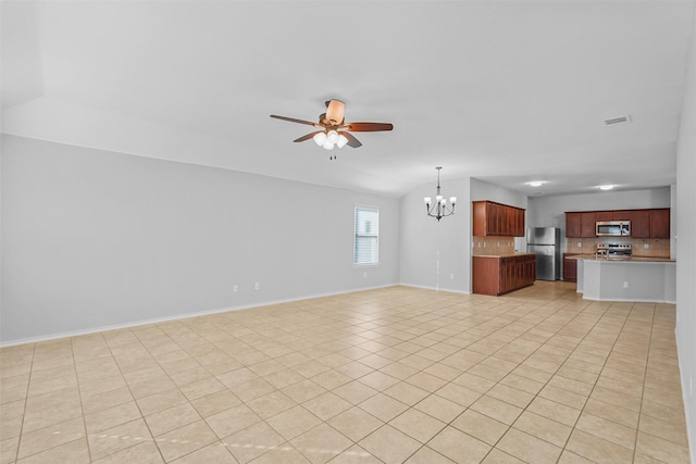 unfurnished living room with light tile patterned flooring, ceiling fan with notable chandelier, and vaulted ceiling