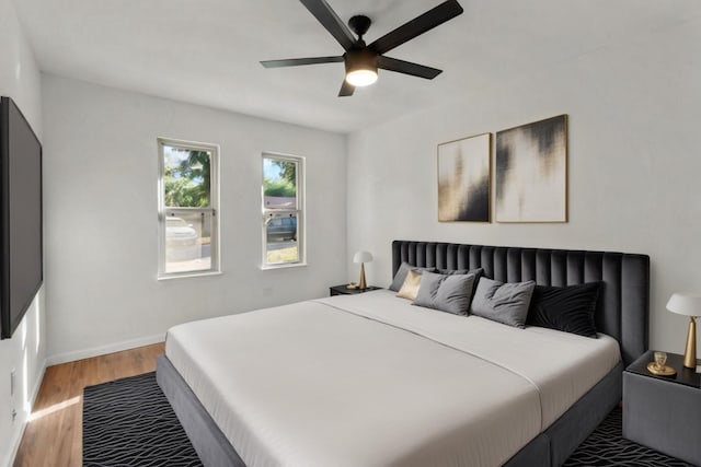 bedroom featuring ceiling fan and light hardwood / wood-style floors