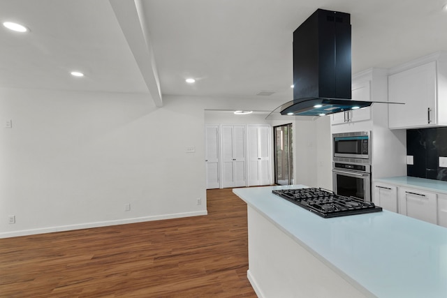 kitchen featuring island range hood, beamed ceiling, dark hardwood / wood-style floors, white cabinetry, and stainless steel gas stovetop