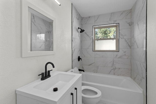 full bathroom with vanity, toilet, and tiled shower / bath