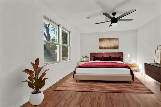 bedroom featuring ceiling fan and hardwood / wood-style flooring