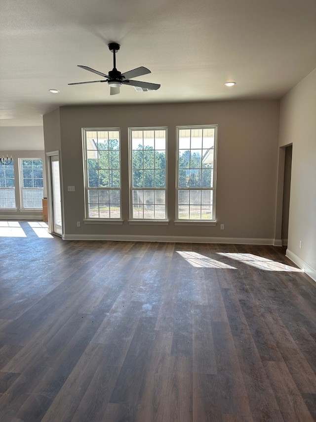 empty room featuring ceiling fan and dark hardwood / wood-style floors