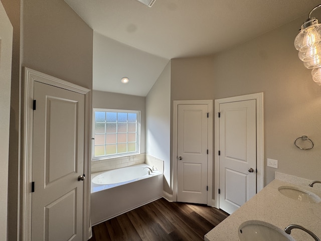 5793 Bunker Way, Blanchard, LA 71107 - full bath with vaulted ceiling, wood finished floors, a sink, and a bath