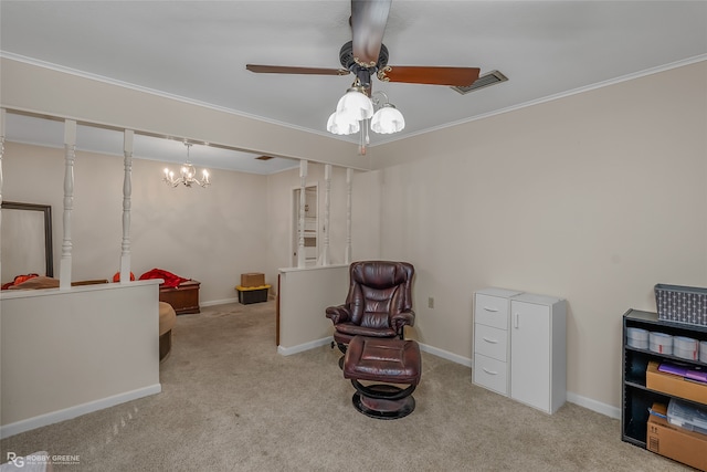 living area featuring ceiling fan with notable chandelier, light carpet, and crown molding