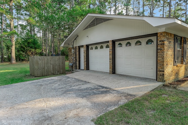 garage with a yard