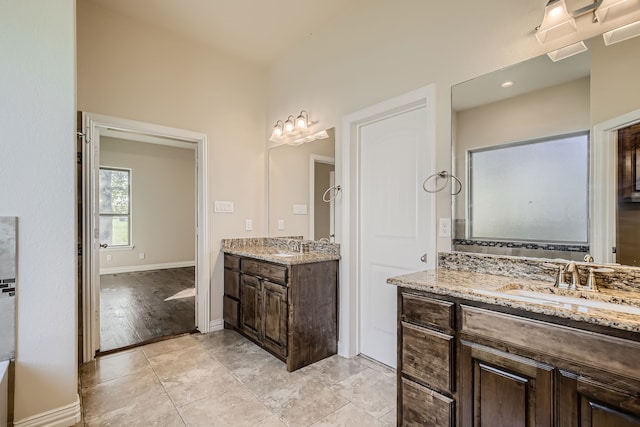 bathroom with hardwood / wood-style floors and vanity