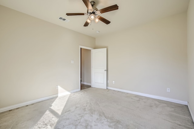 spare room with light carpet and ceiling fan