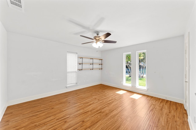 spare room with ceiling fan and light hardwood / wood-style flooring