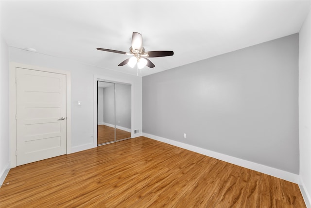 unfurnished bedroom featuring ceiling fan and hardwood / wood-style floors