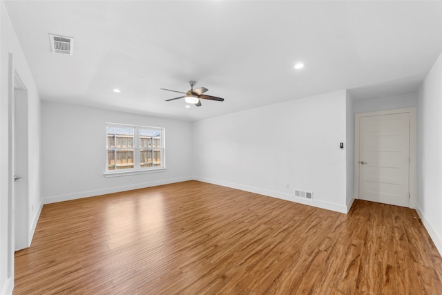 unfurnished room featuring ceiling fan and light hardwood / wood-style flooring