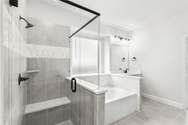 bathroom featuring separate shower and tub, vanity, and tile patterned flooring