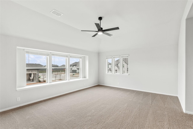 unfurnished room with ceiling fan, carpet flooring, and vaulted ceiling