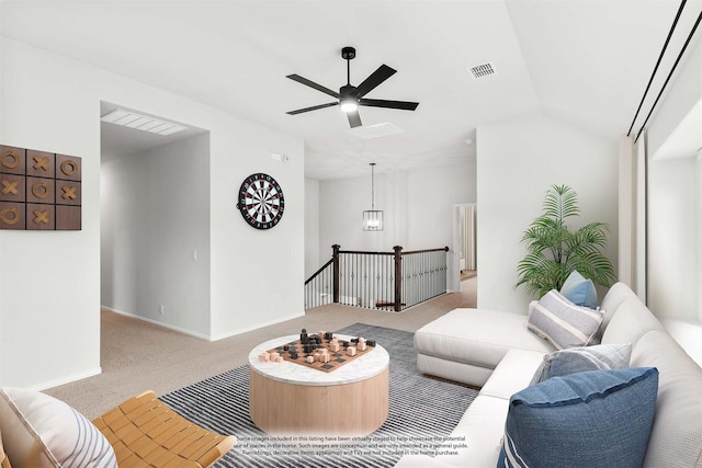 living room featuring light carpet, lofted ceiling, and ceiling fan