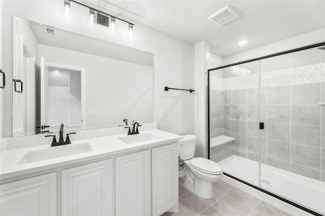 bathroom featuring an enclosed shower, tile patterned flooring, vanity, and toilet