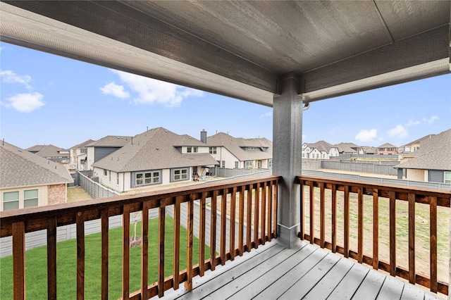 wooden deck featuring a yard