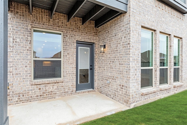 doorway to property featuring a patio area