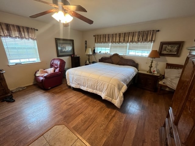 bedroom featuring hardwood / wood-style flooring and ceiling fan