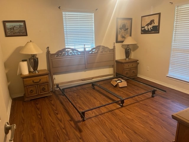 bedroom featuring dark wood-type flooring