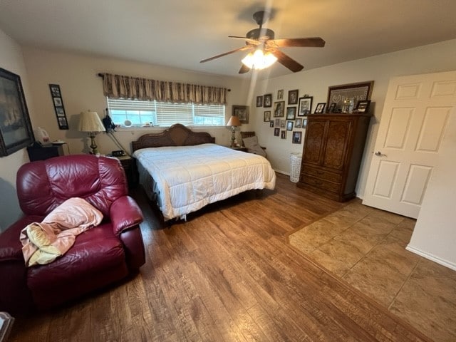 bedroom featuring ceiling fan and wood-type flooring