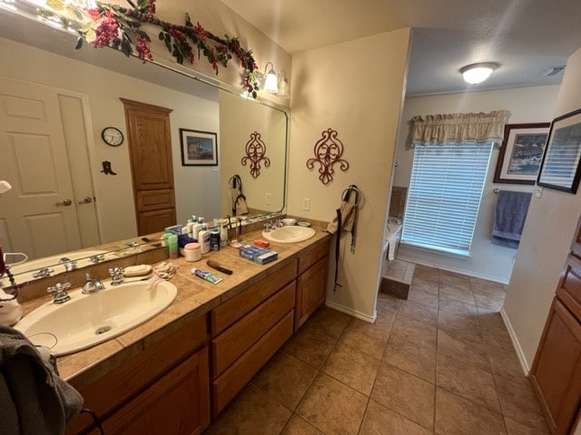 bathroom with tile patterned flooring and vanity