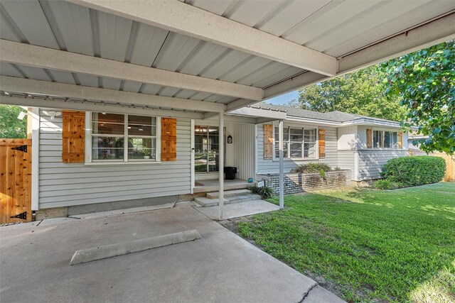 exterior space with a lawn and fence