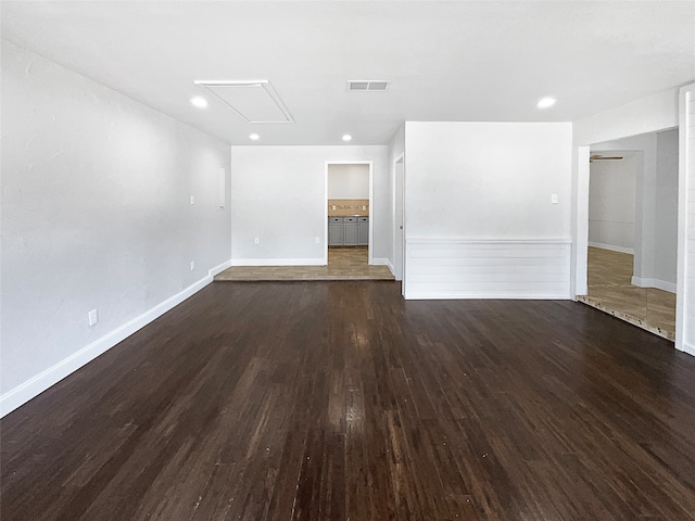 spare room featuring dark hardwood / wood-style floors