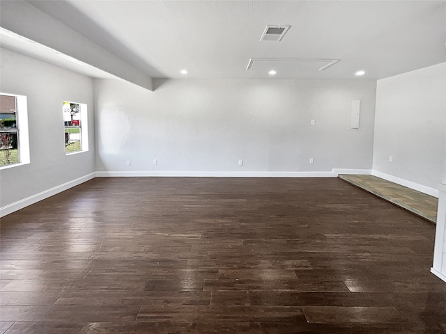 spare room with dark wood-type flooring