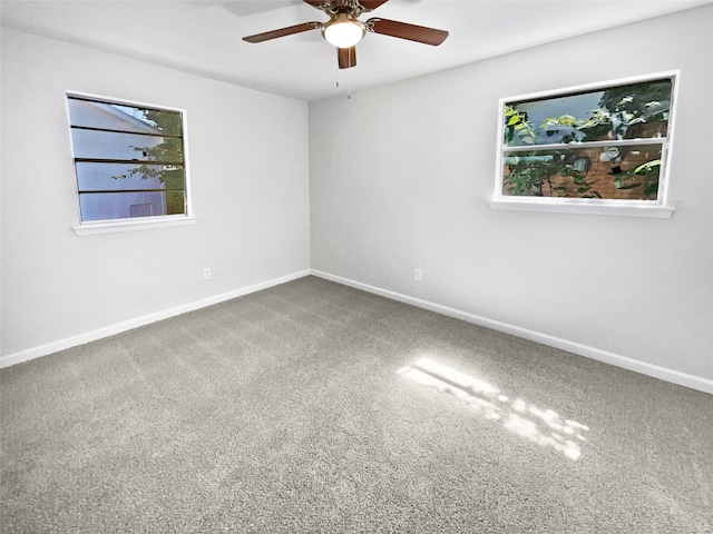 spare room featuring carpet floors and ceiling fan