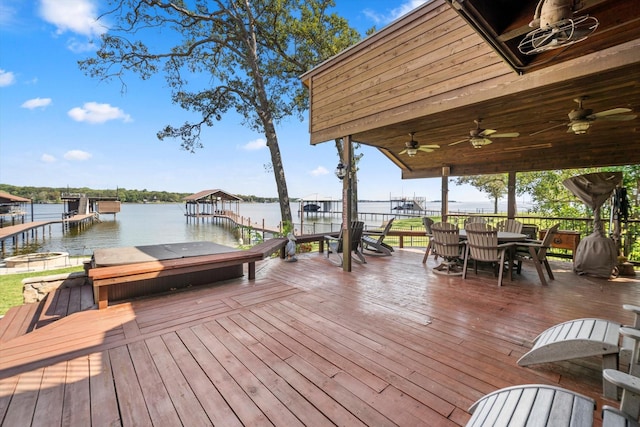 deck with a water view and a boat dock