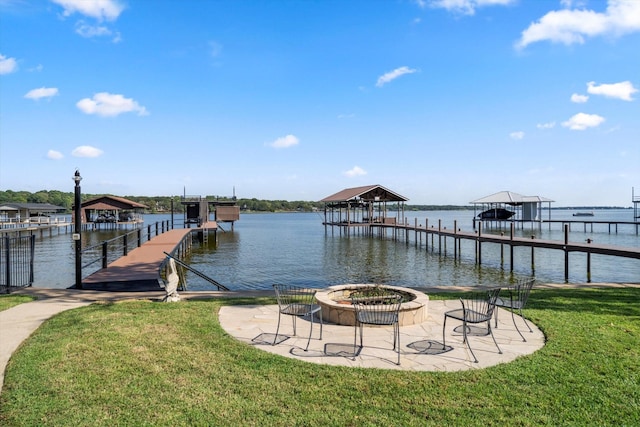 dock area with a water view and a lawn