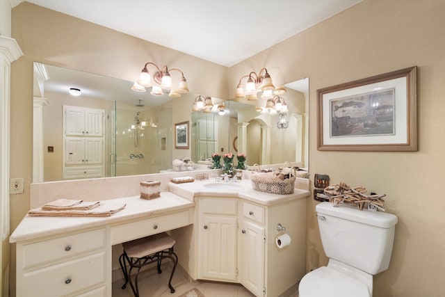 bathroom featuring vanity, toilet, and walk in shower