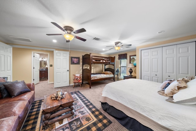 bedroom with carpet floors, ornamental molding, and ceiling fan