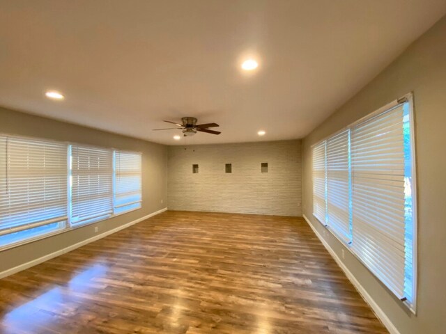 4837 S Ridge Ter, Fort Worth, TX 76133 - spare room featuring brick wall, a ceiling fan, baseboards, recessed lighting, and wood finished floors