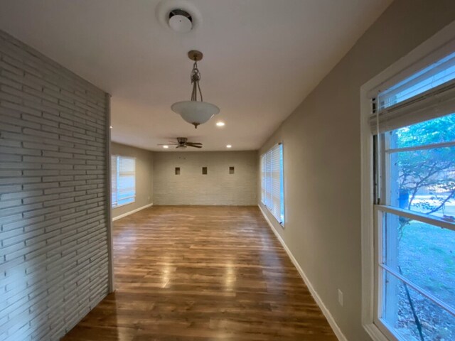 4837 S Ridge Ter, Fort Worth, TX 76133 - interior space with ceiling fan, brick wall, dark wood finished floors, recessed lighting, and baseboards